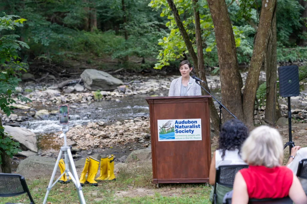 Nature Forward Director of Conservation Eliza Cava speaking at the “Story of Streams” event along Northwest Branch in August 2022. Photo by Ben Israel/Nature Forward.