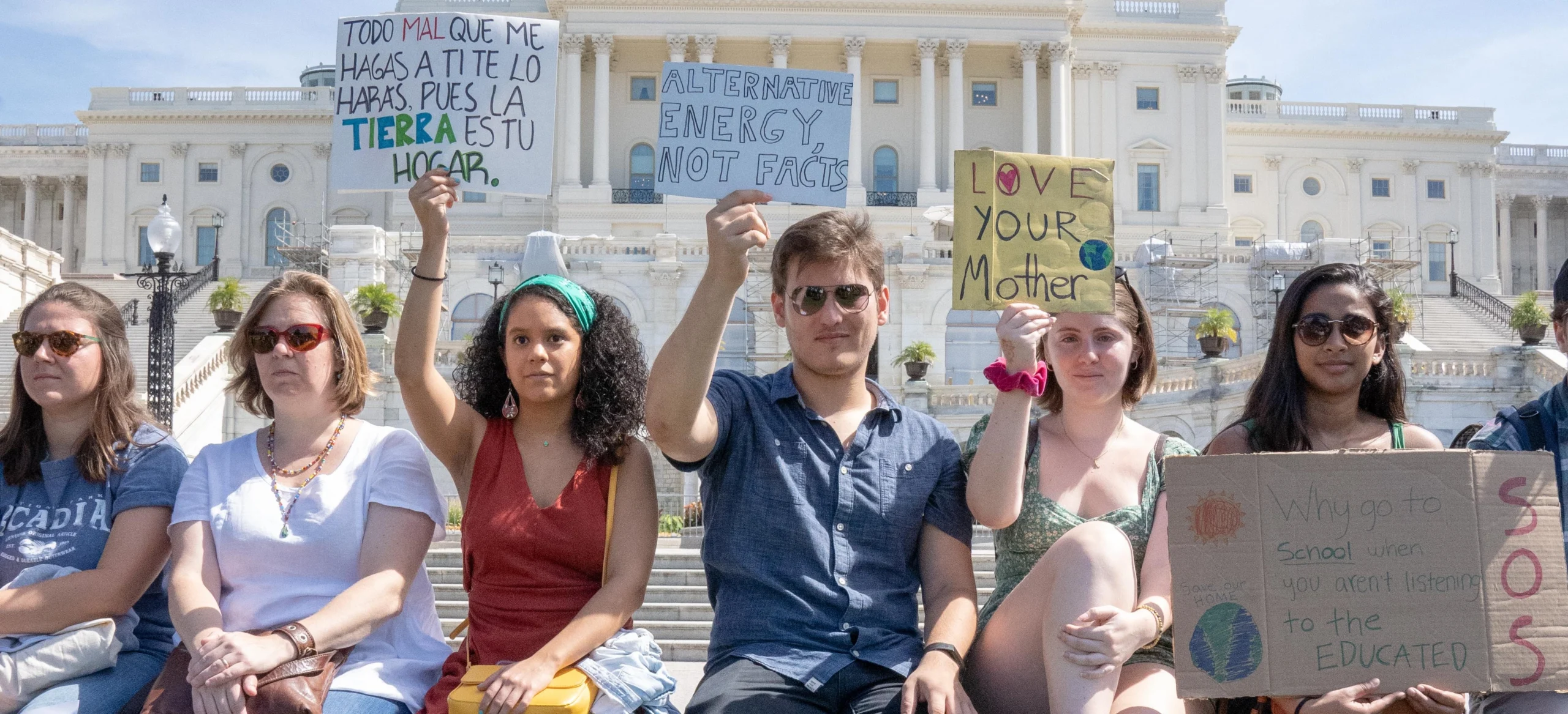 People holding protest signs at Climate Strike @ US Capitol (2019)