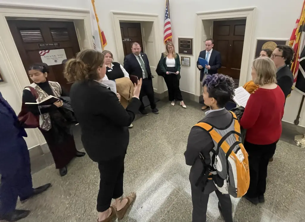 Nature Forward's Lydia Lawrence and partner advocates do a "hallway meeting" with MD Representative Harris's staff at Choose Clean Water Lobby Day on March 6, 2024