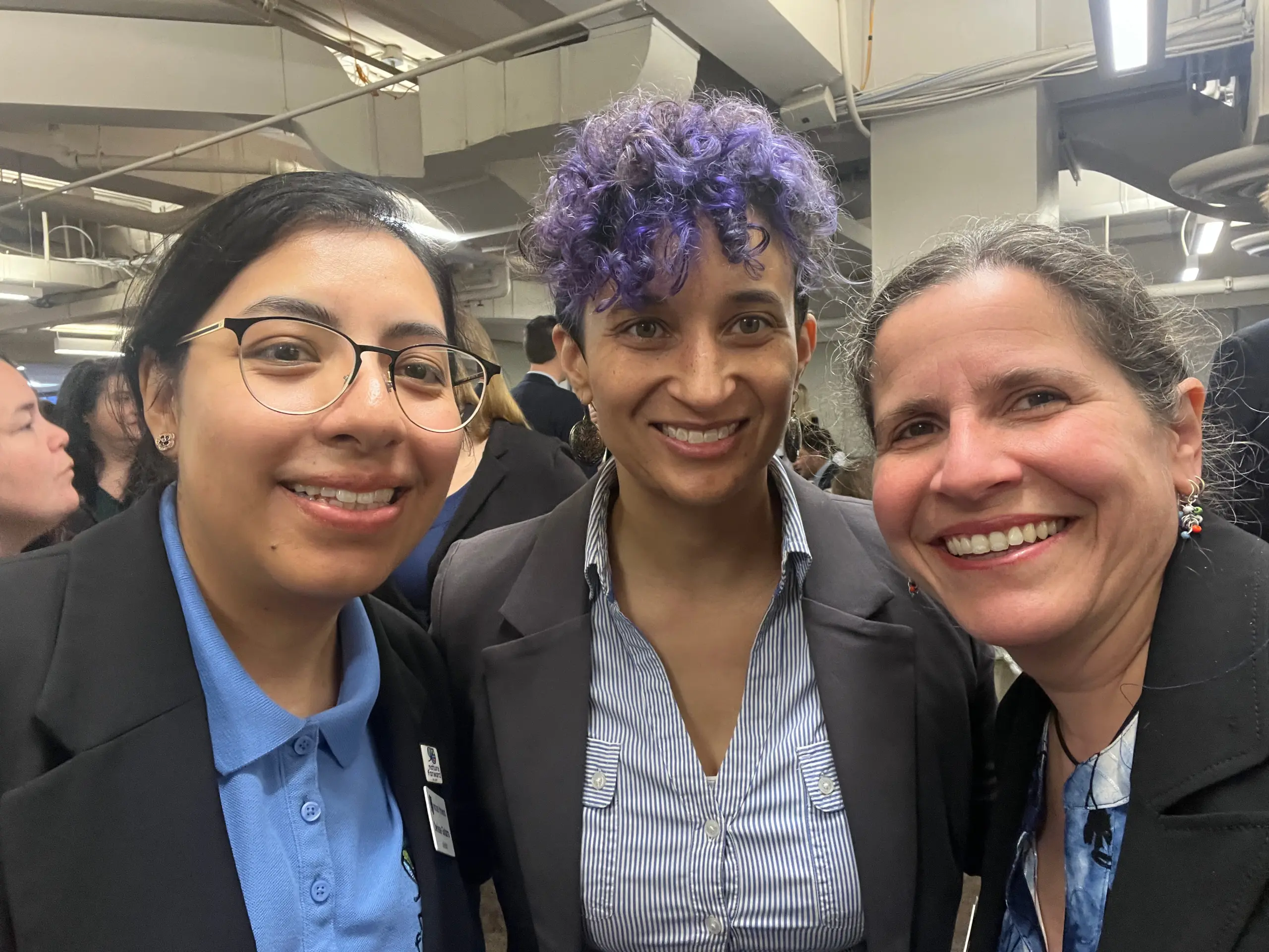 Nature Forward's Denisse Guitarra (MD Conservation Advocate), Lydia Lawrence (Director of Conservation), and Renee Grebe (NOVA Conservation Advocate) get ready for their day of meetings during the Choose Clean Water Lobby Day on March 6, 2024.