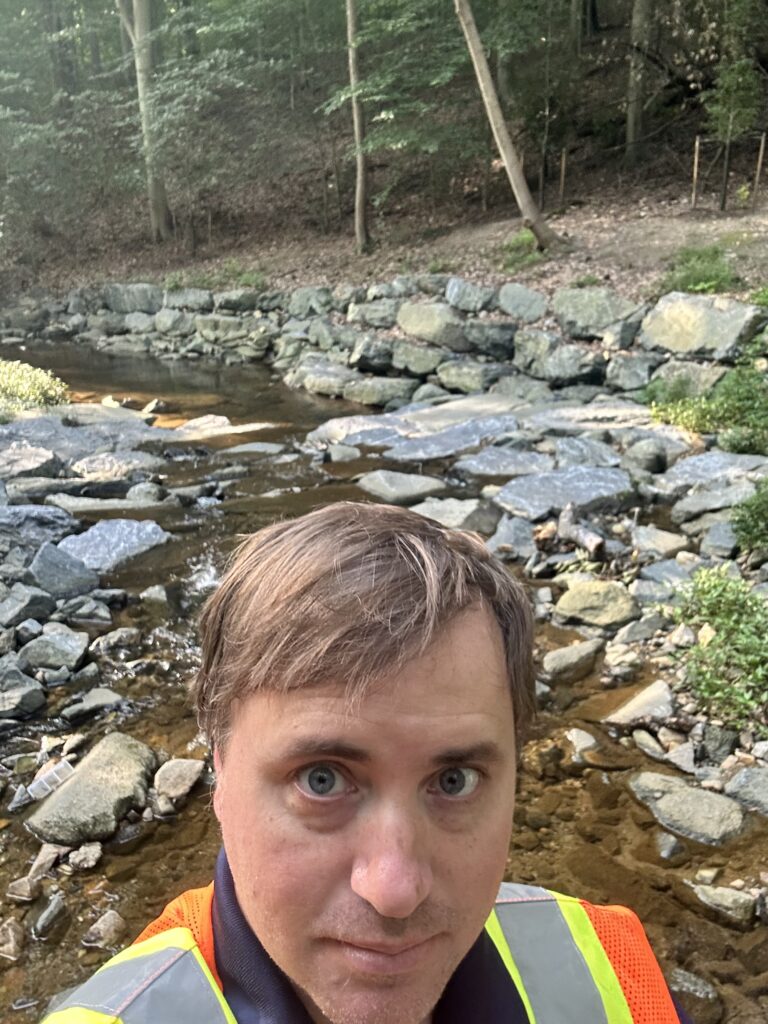 Me standing next to the newly restored Soapstone Valley Creek in Northwest DC.
