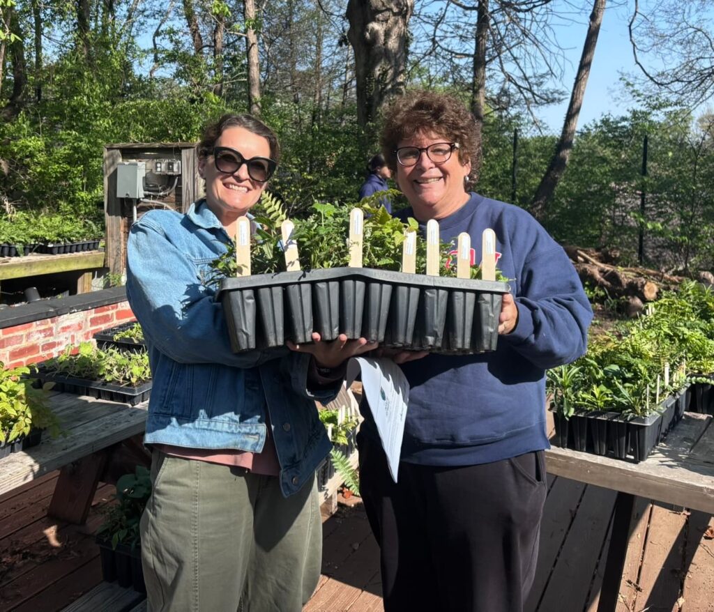 two women showing off their garden work