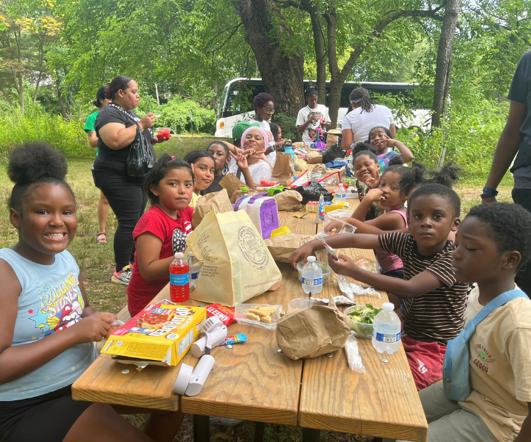 Children having lunch at the picnic area of the Nature Play Space at Woodend Nature Sanctuary