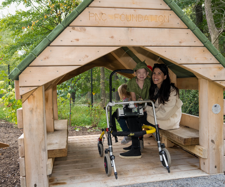 A parent and child at the Nature Play Space at Woodend Nature Sanctuary